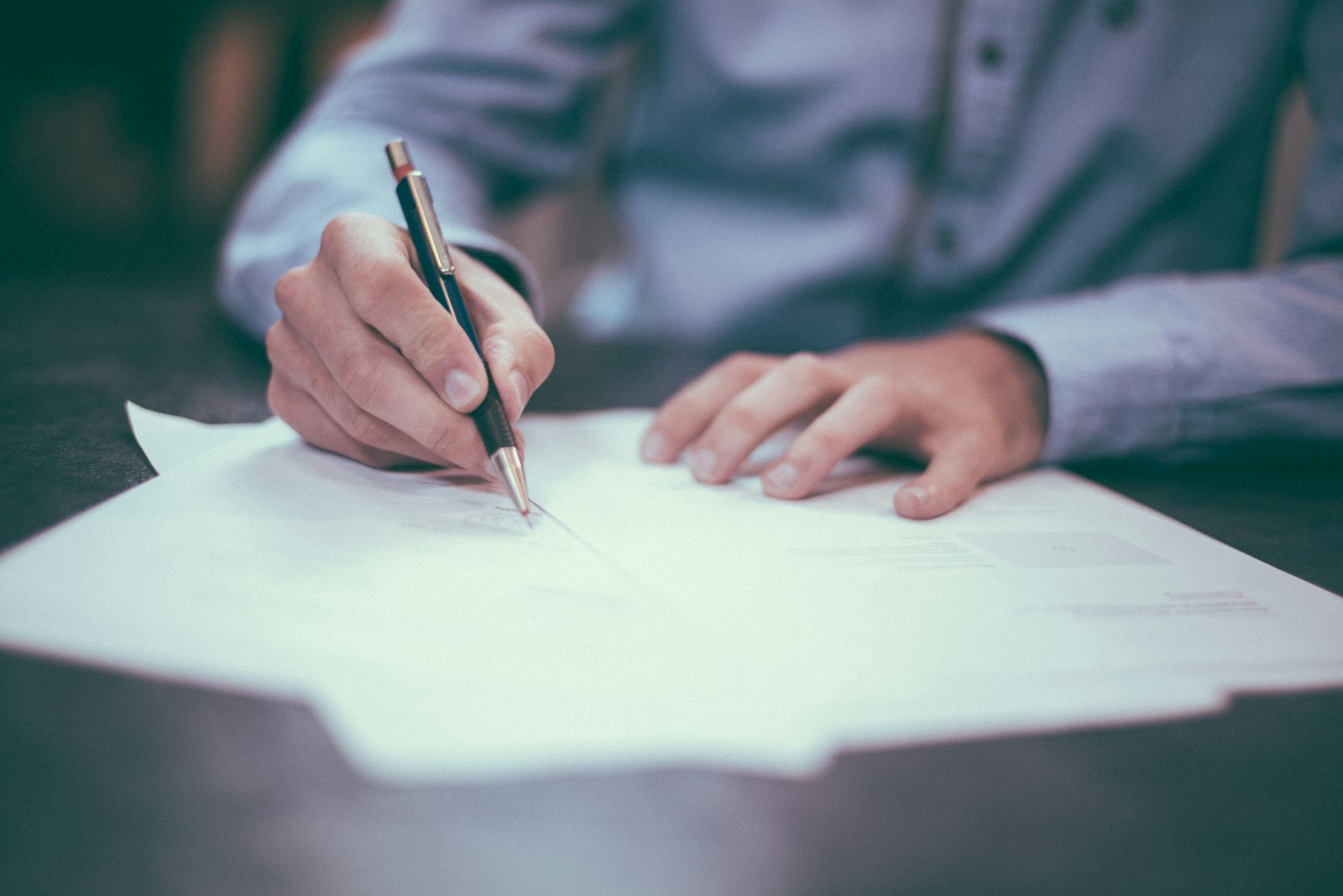Finance professional reviewing contract documents